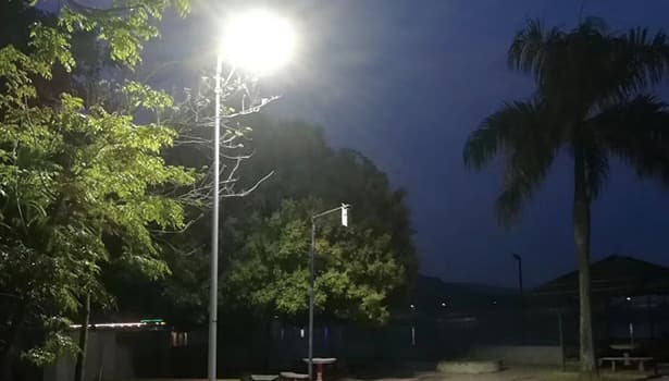 Solar street lights illuminating a residential community at night