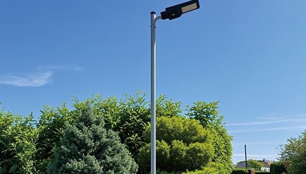 Durable solar street light illuminating a coastal road