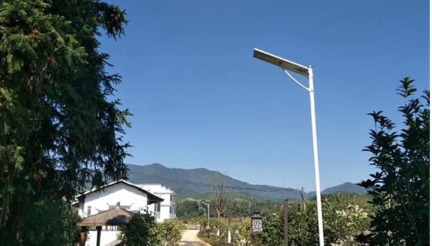 Modern all-in-one solar street light with sleek design on roadside