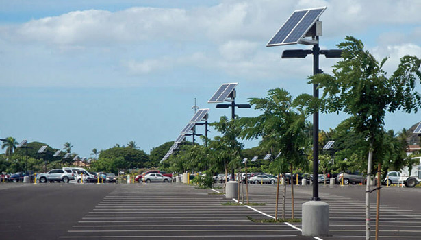 Smart solar street light in parking lot, cutting public lighting costs