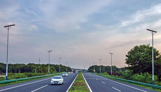 0W solar street lights on a wide open road at sunset, presenting aesthetic and functional design