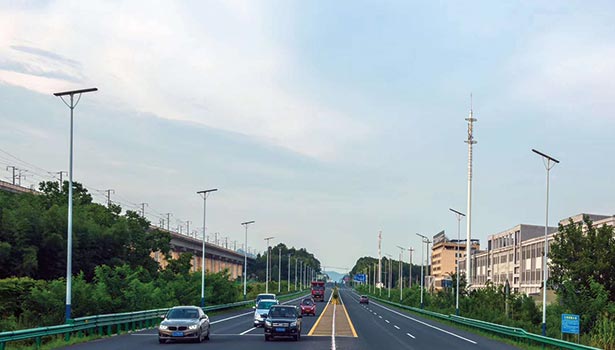 80W solar street lights along an urban road on a sunny day