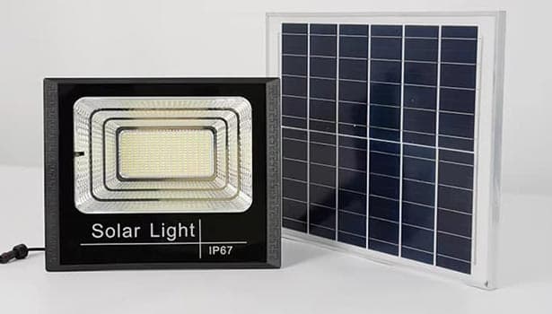 100W solar LED floodlight enhancing safety in a commercial parking lot