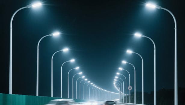Illuminated solar street lights installed along highway at night