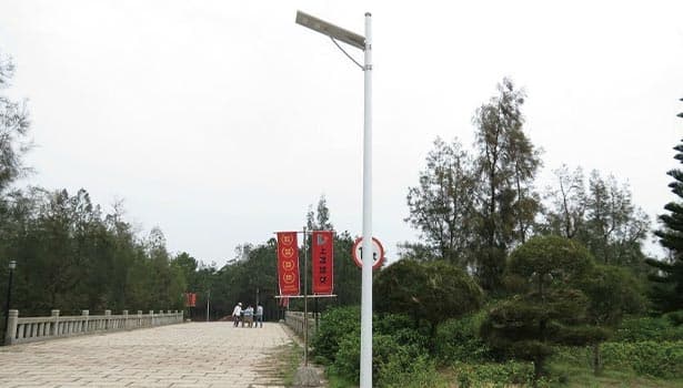 Solar street light installed in a residential adjacent park area, providing reliable lighting for pedestrians and community spaces.