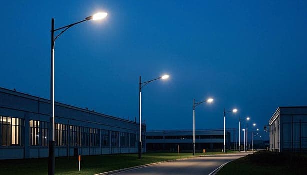 Industrial solar street lights lighting up a factory area at night, providing bright and reliable illumination for industrial zones.