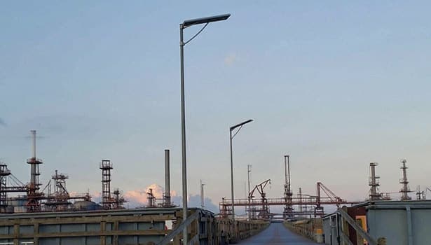 Industrial solar street lights in a refinery zone, offering durable and low-maintenance lighting for heavy-industry environments.